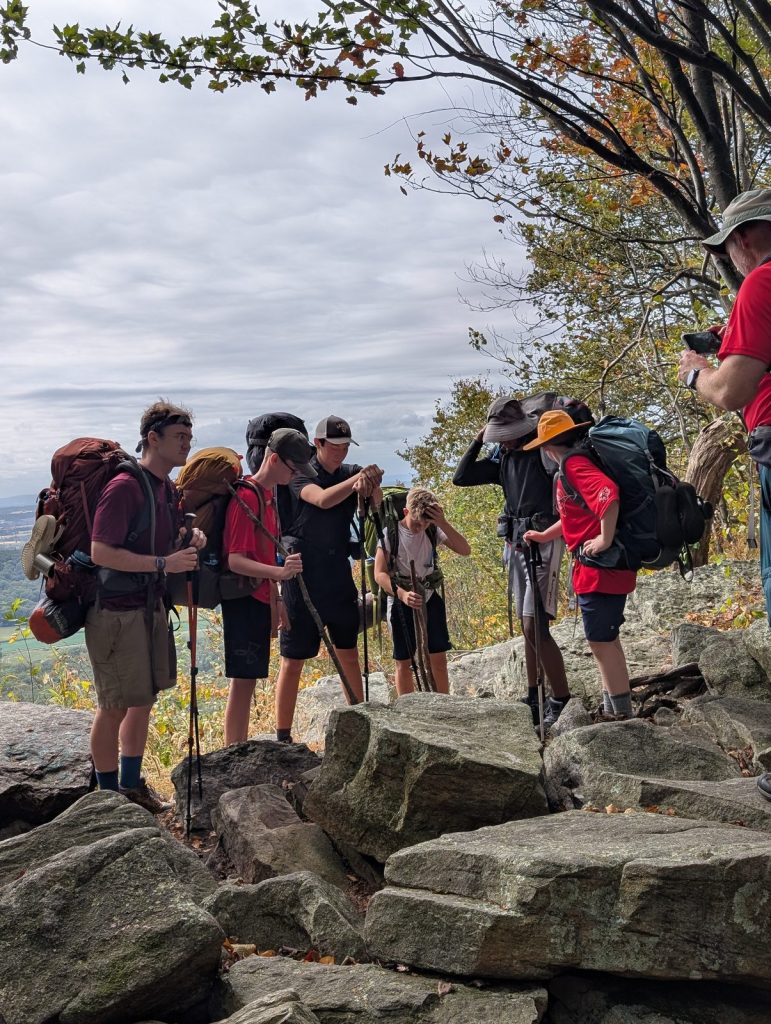 Troop 229 Scouts backpacking on a rocky overlook